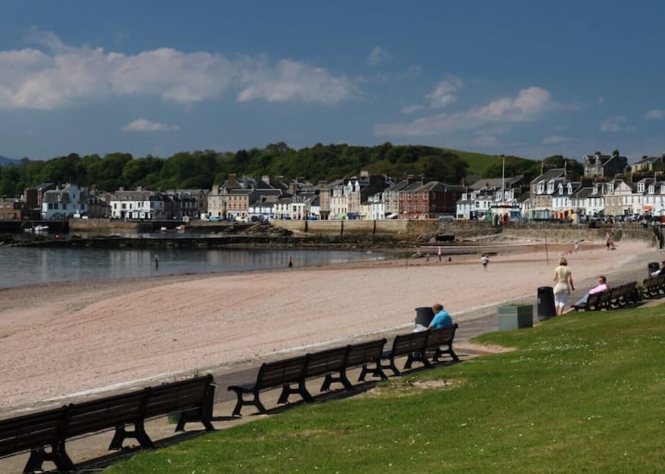 Newton Bay with pier & harbour in background.