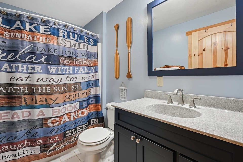 The main-level bathroom has a single vanity sink and a tub/shower combo