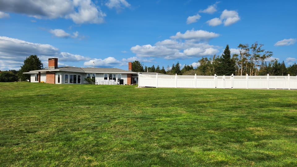 View of the house -- the fenced area is the pool.
