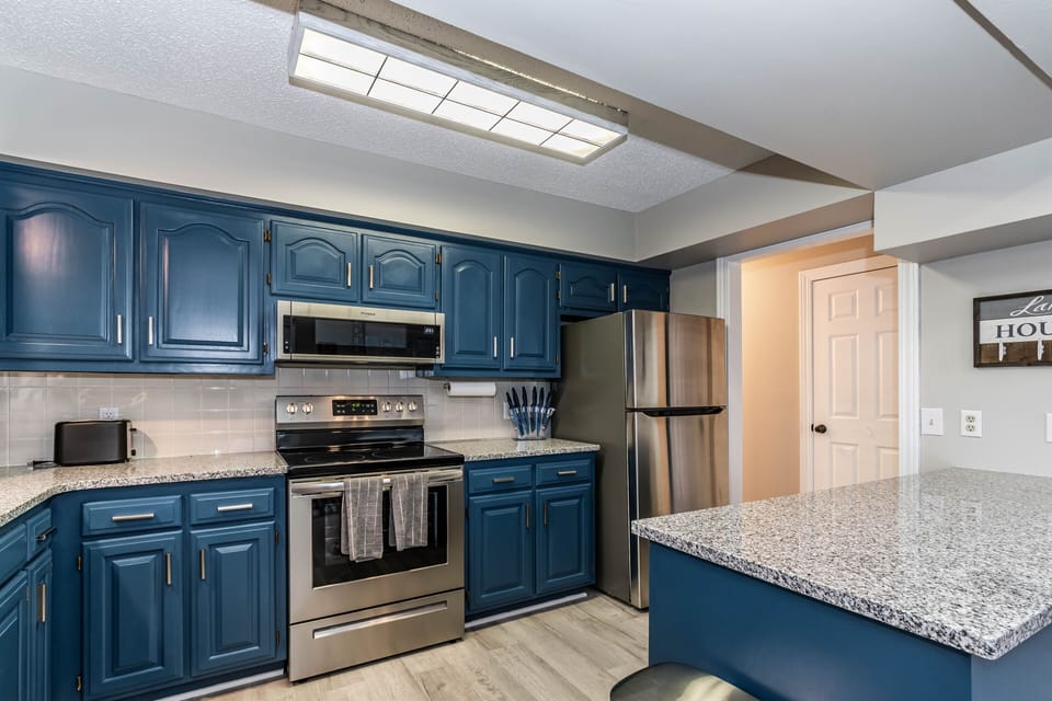 Kitchen with brand new appliances, including dishwasher