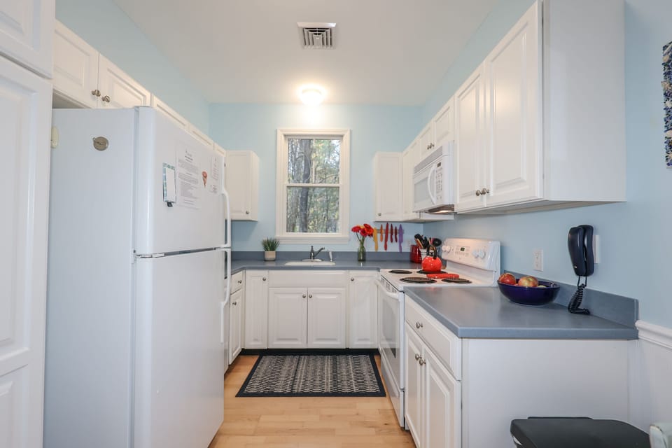 Kitchen ~ full size refrigerator, oven, dishwasher, and microwave