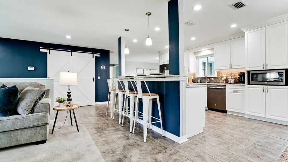 The breakfast bar comfortably seats 4, making it an ideal spot for kids to eat.