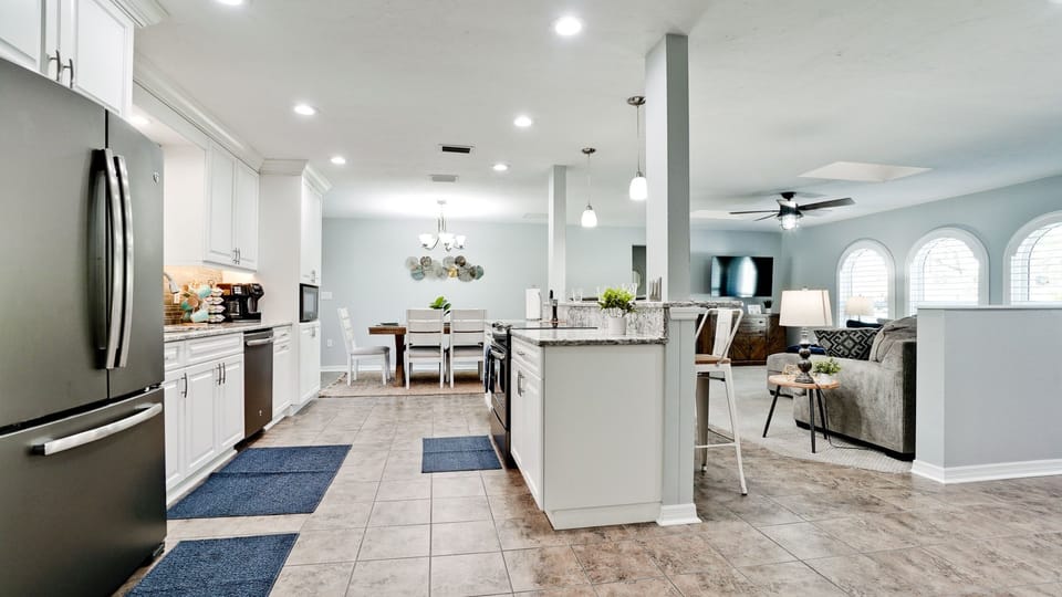 Our fully equipped kitchen that gracefully opens up to the living room space. 