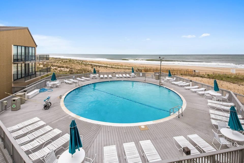 Ocean front pool and beach are steps away from the front door.