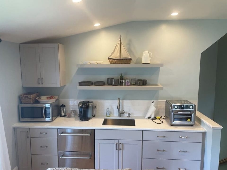Kitchenette sink, microwave, air fryer, conv..oven, refrig & freezer drawers.
