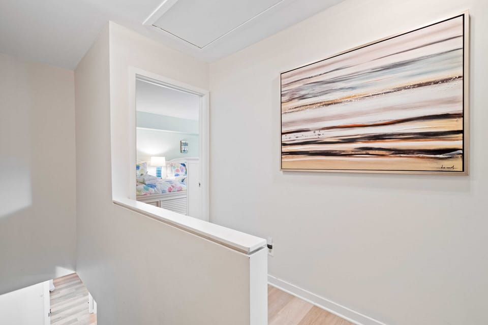 Upstairs landing with bedrooms on opposite sides.