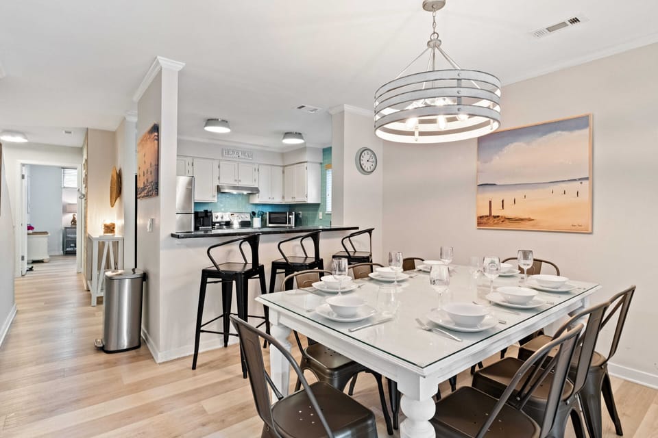 Dining table seats 8; Kitchen counter seats 3. 