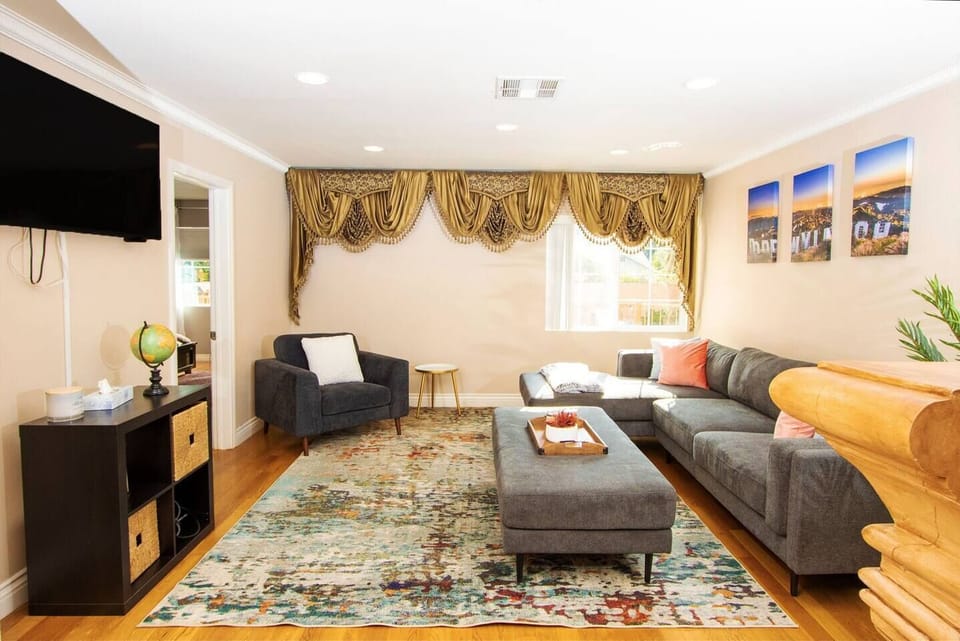 1 of 3 common areas.  Enjoy a movie night on this comfy couch with smartTV. 
