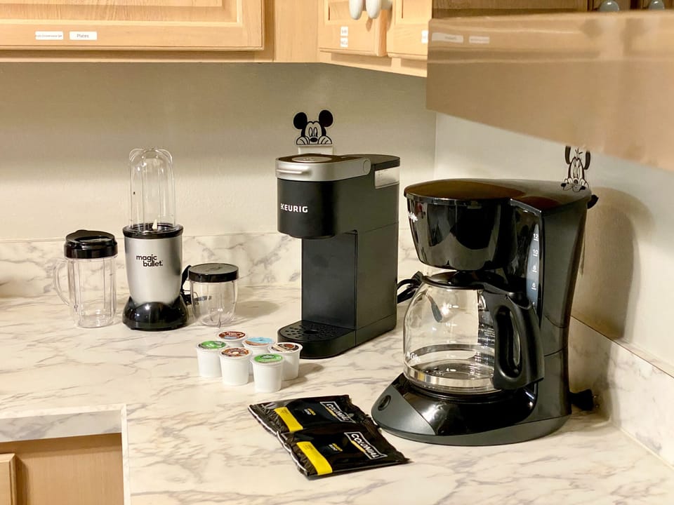  A selection of K-Cup® pods and Colonial coffee pack is provided.