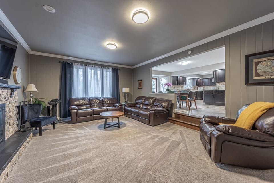 Spacious first floor living room with leather reclining furniture