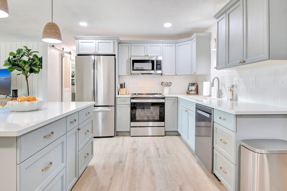 Brand new stainless steel appliances and premium cookware