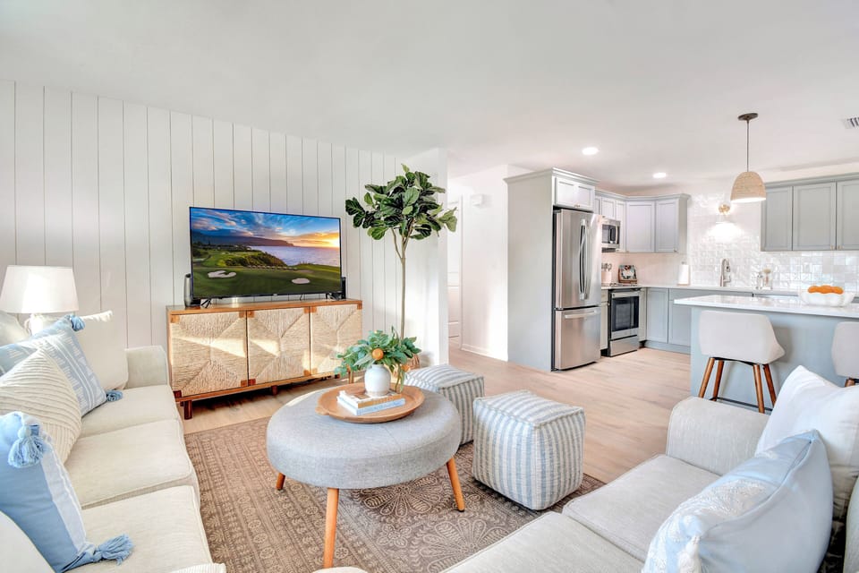 Main living space with comfortable sofas and a fully equipped kitchen 