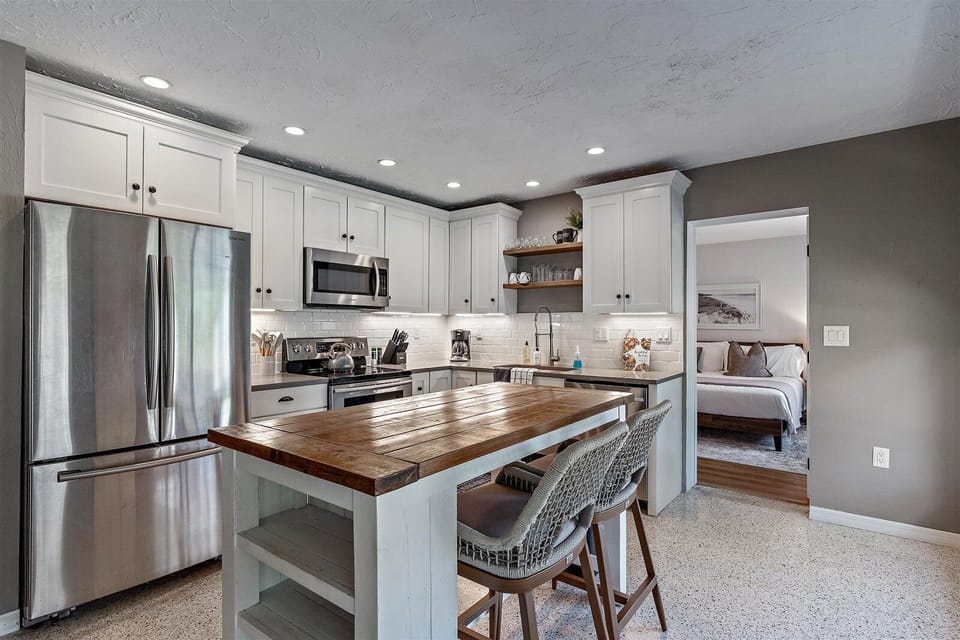 Newly renovated kitchen space with plenty of cupboard storage.