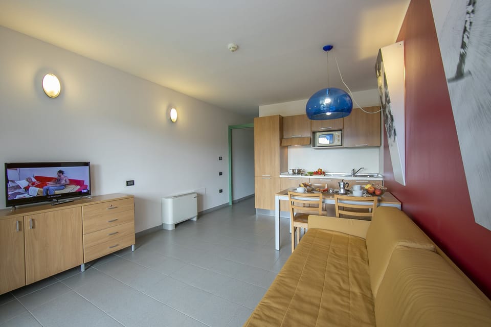 living room with kitchen and dining table view