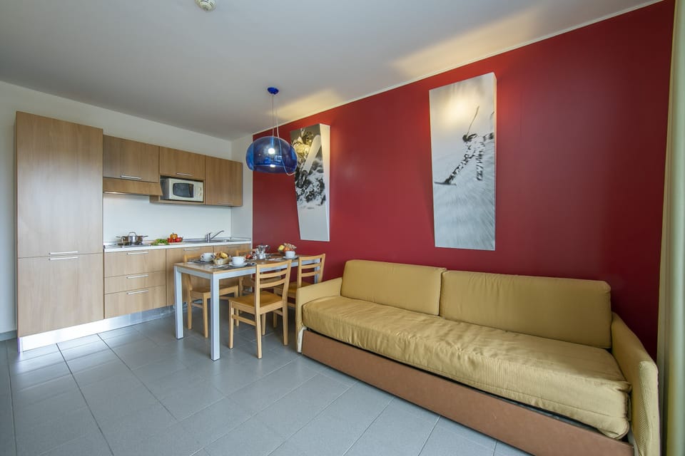 living room with kitchen and dining table view