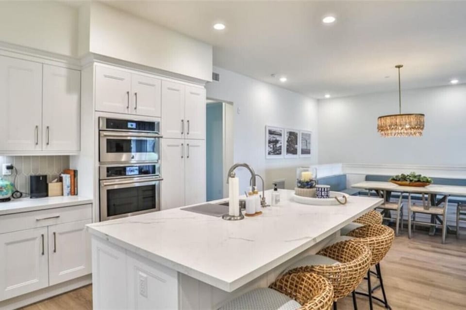 Fully Stocked Gourmet Kitchen with Stainless Wall Oven & Convection Microwave Plus Seating for Five at the Breakfast Bar