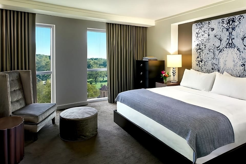 Unwind in a sunlit king room with soothing views.
