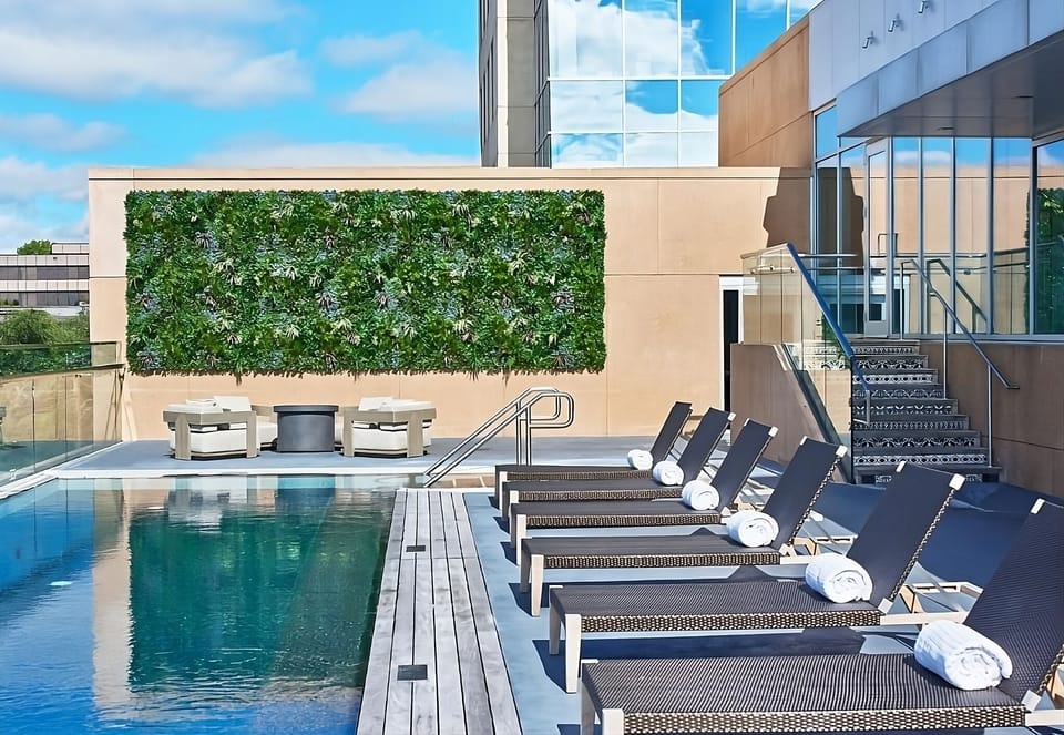Lounge poolside with skyline views and resort-style comfort.