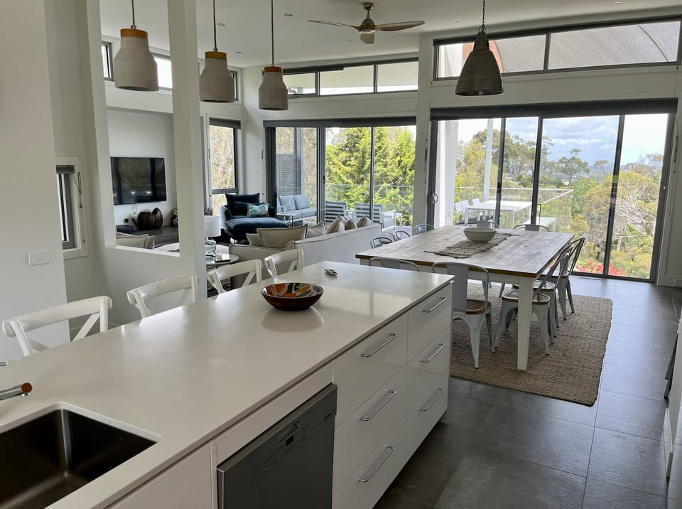 Gourmet kitchen with butlers pantry - looking out to dining room and bay