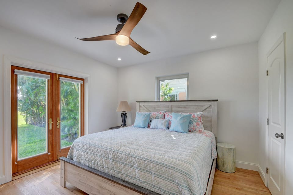 Primary Bedroom with views out to the pool and golf course!