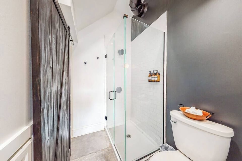 Full Bathroom 1: Our bathroom is all set with important features like a toilet and a shower area.