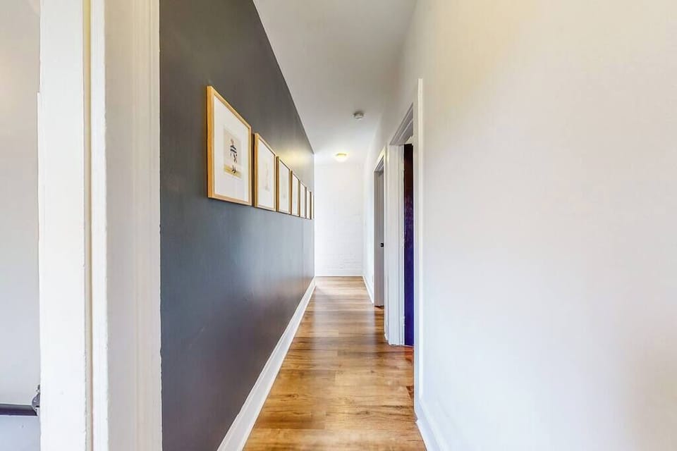 This hallway on the second floor leads to each of the bedrooms.