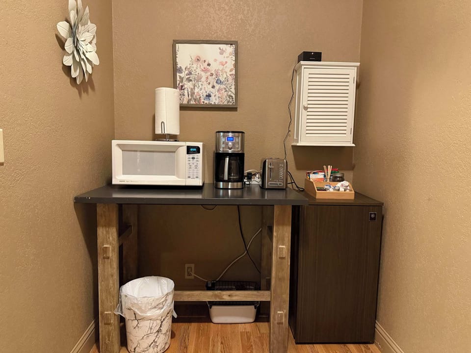 Kitchenette with microwave, coffee station, and guest essentials.