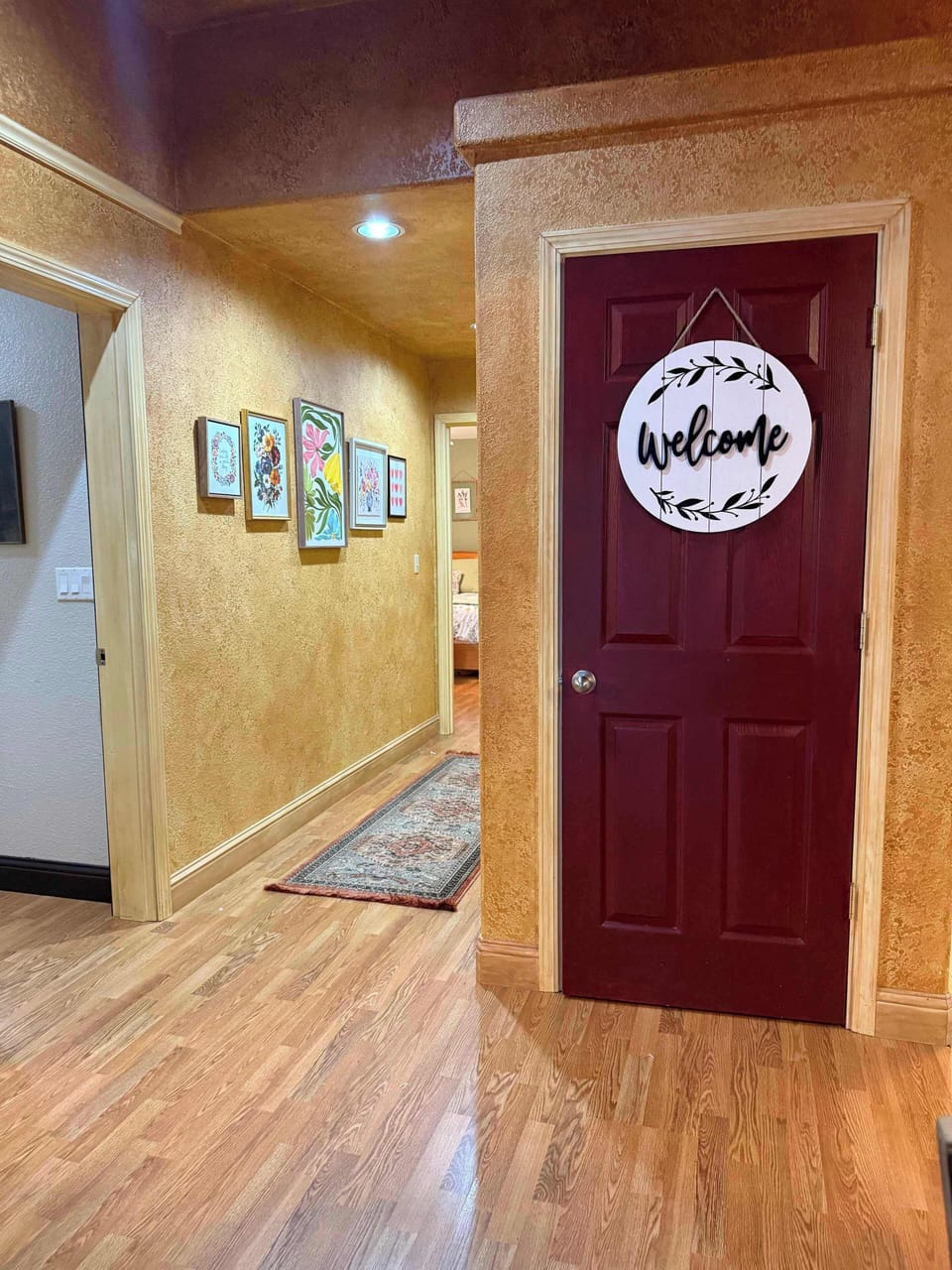 The door on the left side is the hall entrance to the bathroom. The red door is a pantry.