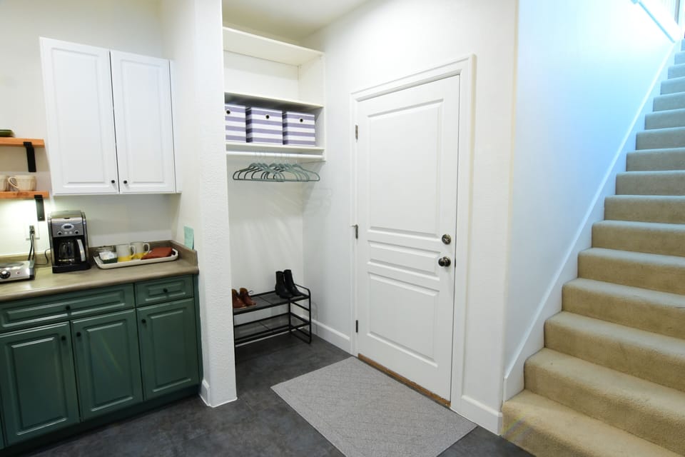 Entrance to your parking spot in the garage. Stairs lead to living/dining room.