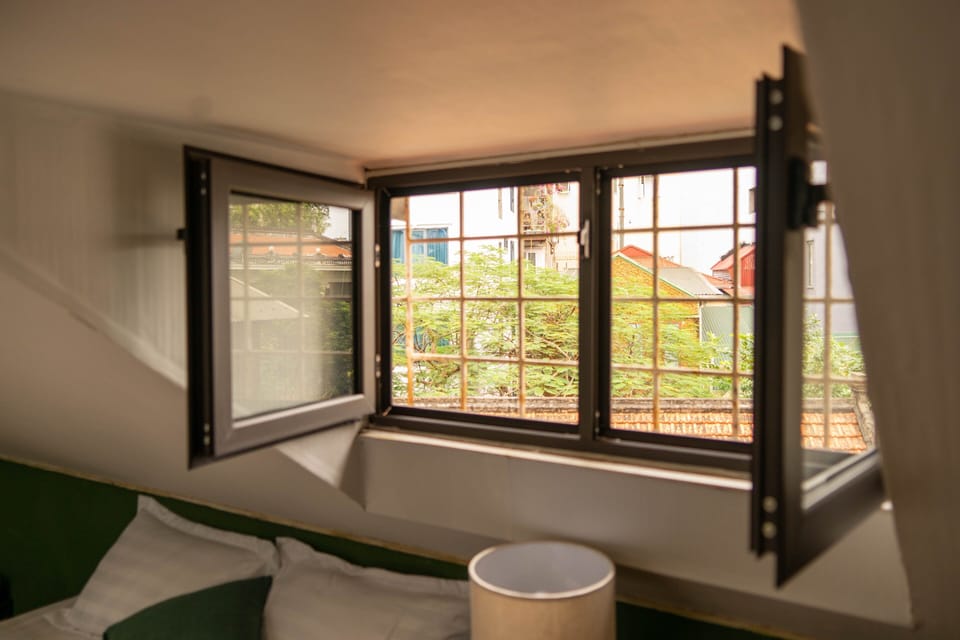 2nd  floor bedroom is 30m2 wide with 2 beds, window overlooking the sky