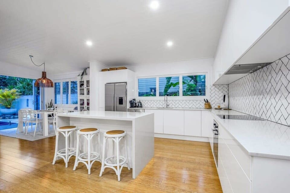 Spacious family size kitchen with large island bench and breakfast bar