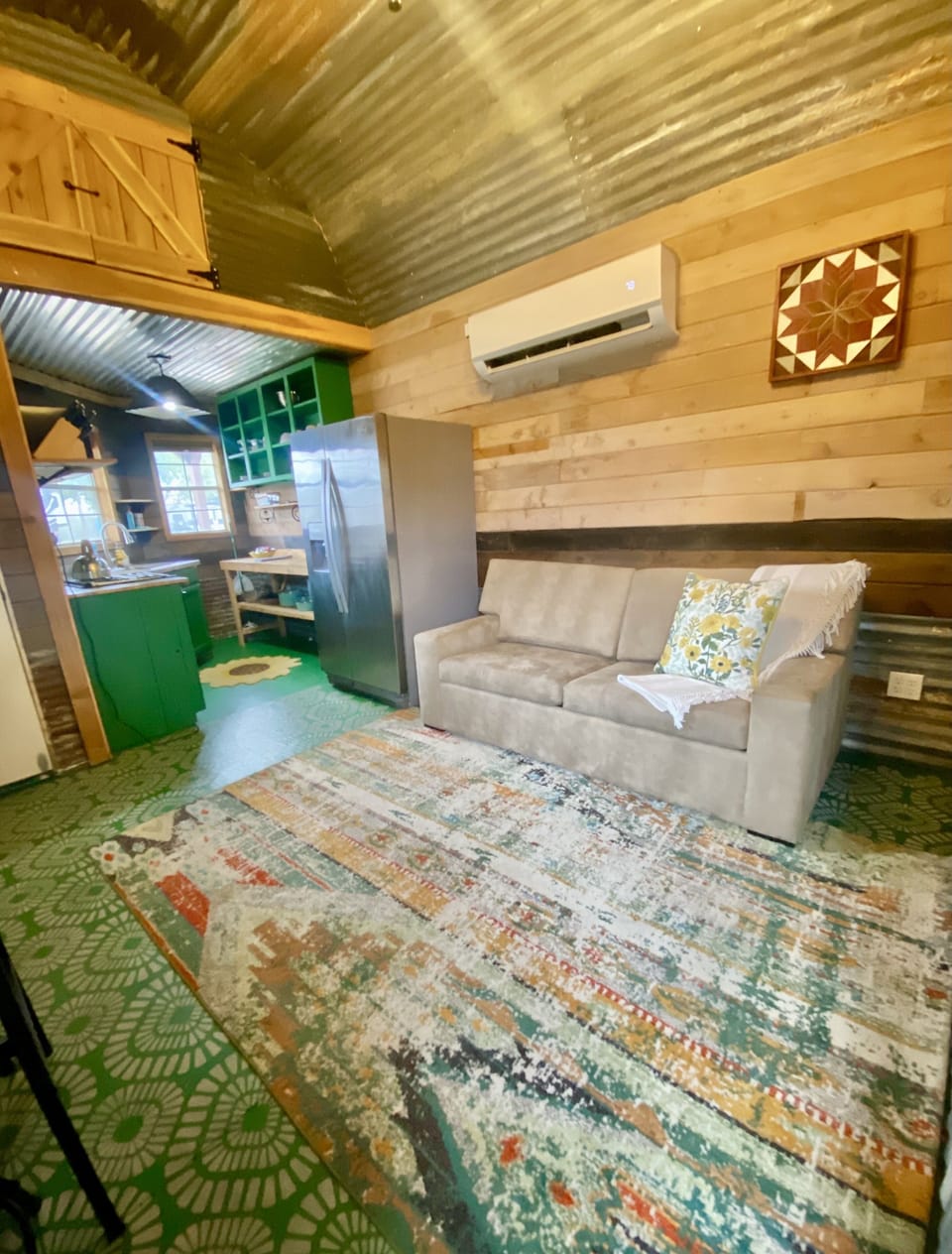 Cozy living area with full sofa sleeper, SMART TV, and blackout shades.