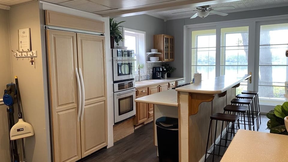 The large kitchen island has four bar stools.