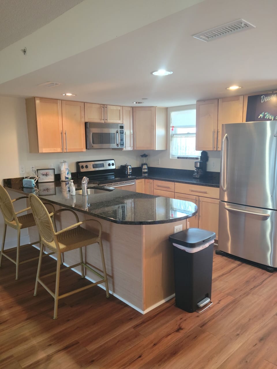 clean, well equipped kitchen with granite counter top, and Keurig coffee maker. 