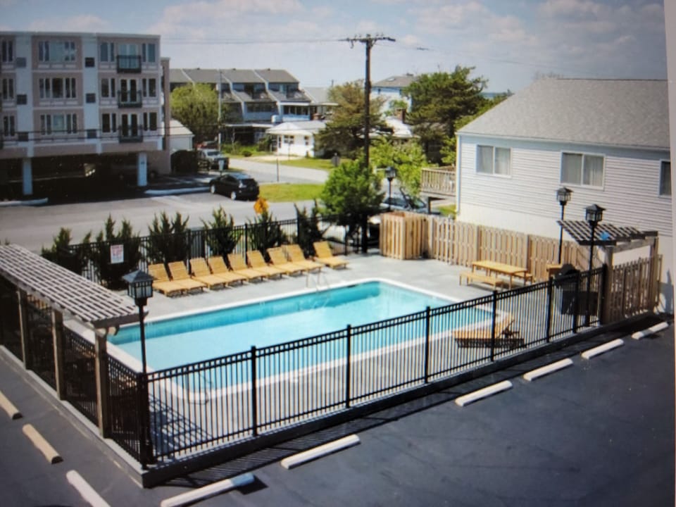Nice community pool and grill station steps away 