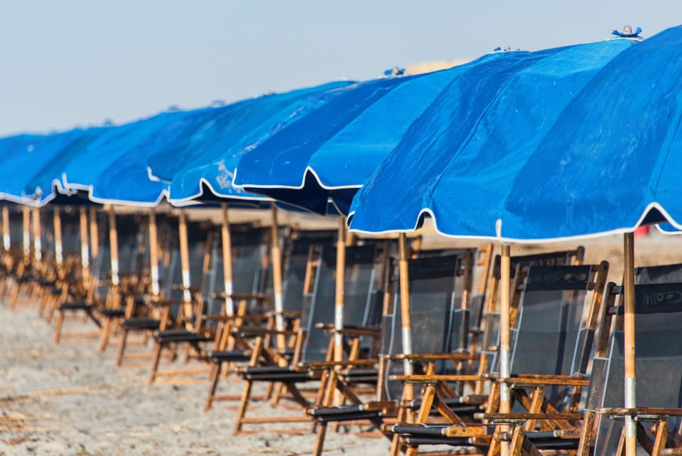You can rent an umbrella setup from the lifeguards during peak season