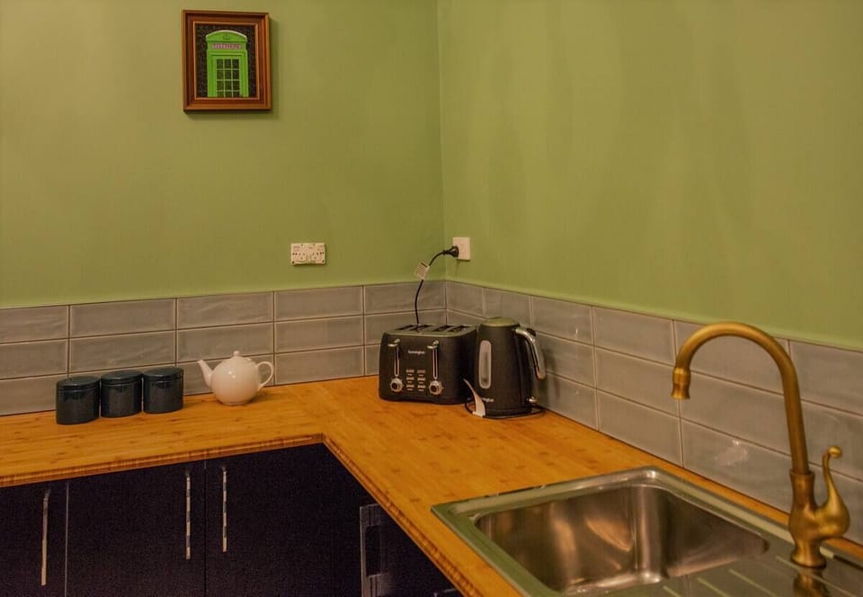 Simple well-appointed Kitchen-Dining (with adjoining laundry room).