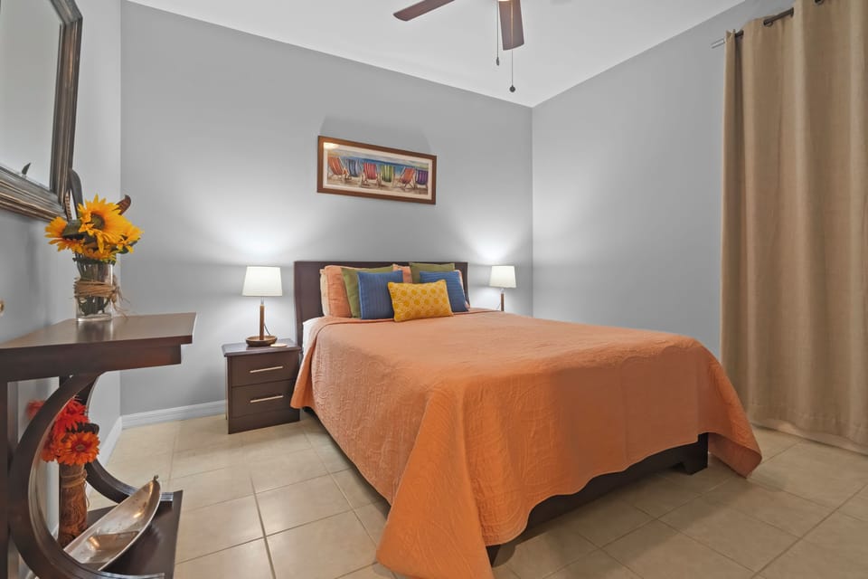 The unit's second bedroom has a queen bed and stays shaded a cool throughout the day.