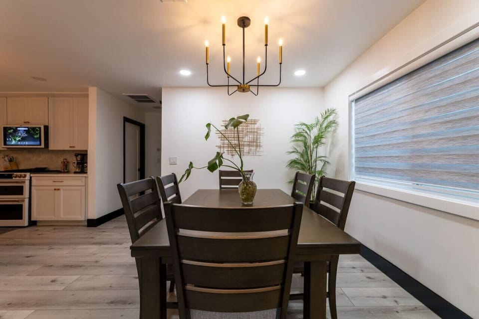 Dining Room: Gather around the stylish table and enjoy meals with a modern twist!