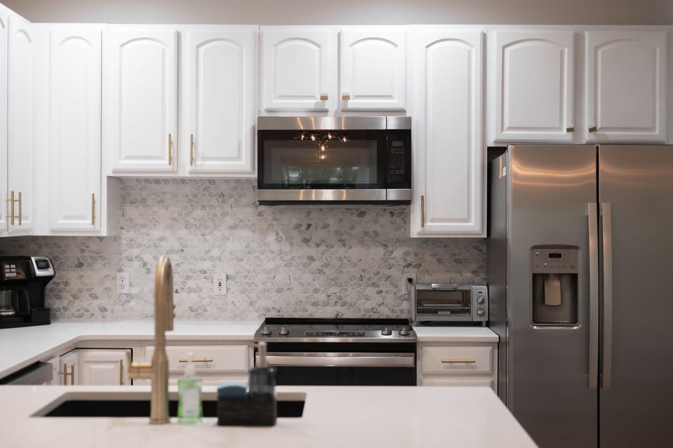 Everything needed:  Coffee maker, toaster, blender, wine glasses and more...