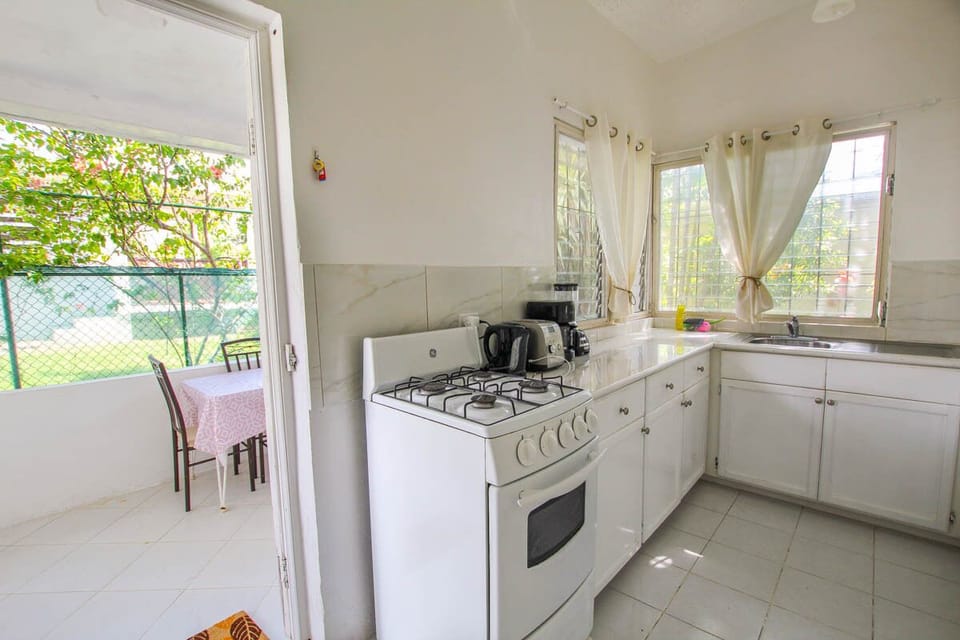The kitchen opens out onto a back patio