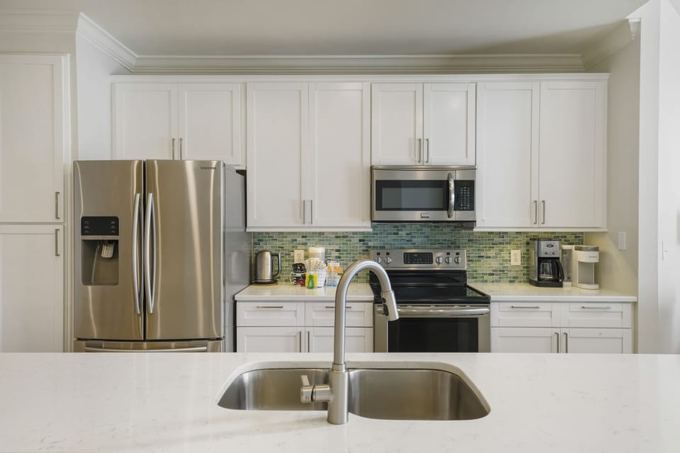Full kitchen with stainless steel appliances