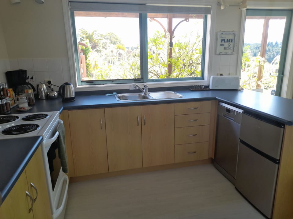 Kitchen with oven, dishwasher, fridge freezer and lots of cupboard space