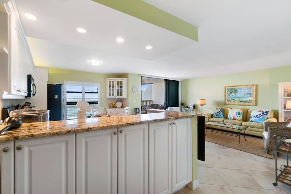 Just around the corner from the entry to the main livingo area offers expansive water views from every angle.