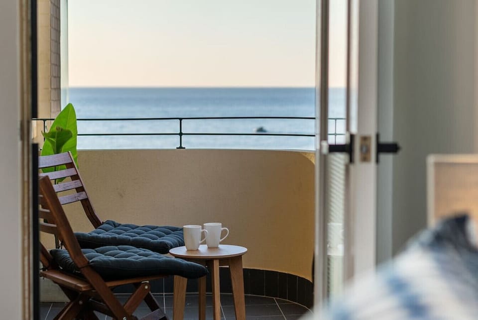 A cozy terrace setup featuring two comfortable chairs, perfect for enjoying quiet moments or scenic views in a relaxed outdoor setting.