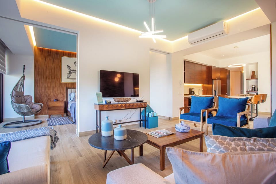 The living room has a flat-screen TV