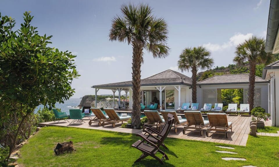 Outdoors: Beautiful garden surrounding the property, many lounge areas. Large private parking