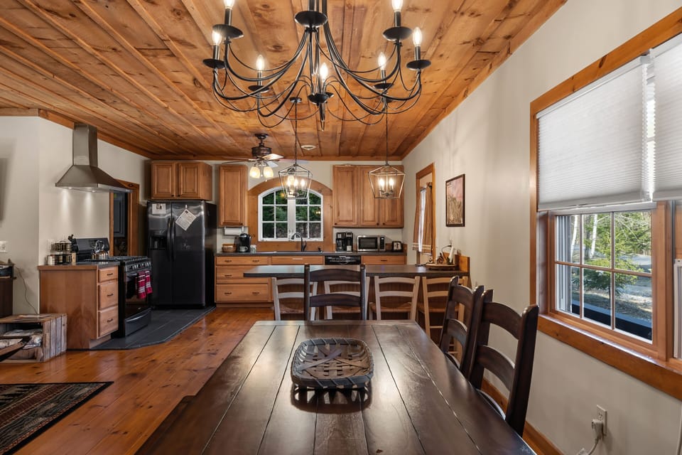 Large farmhouse dining table in an all inclusive floorplan.