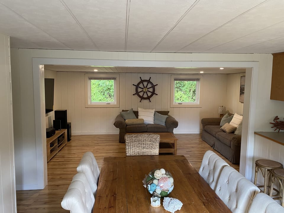 Open Concept Living, Dining, and Kitchen with 70" TV, 8 Person Dining Table