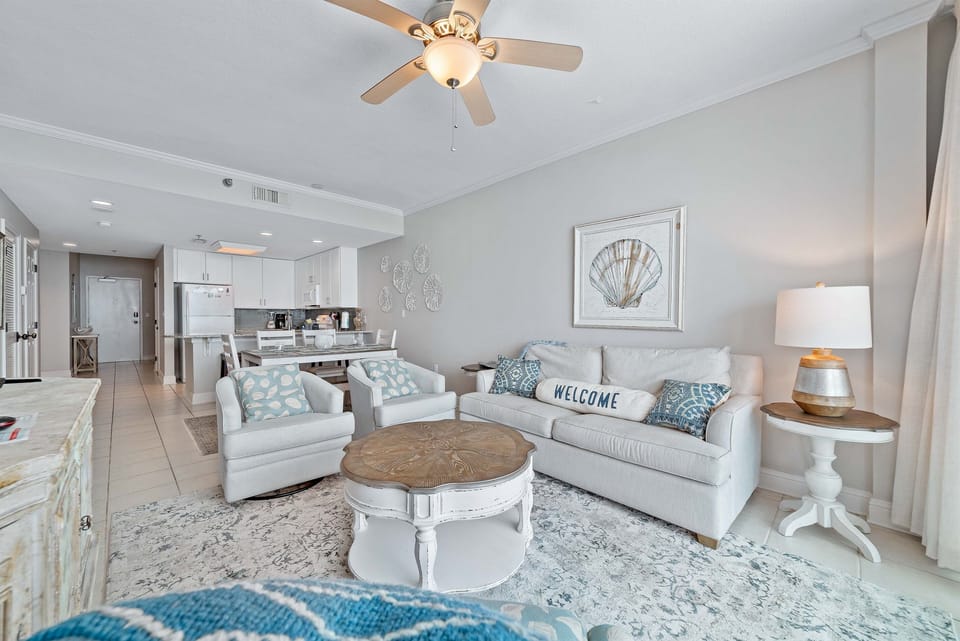 Enjoy your morning coffee with a breathtaking ocean view from the comfort of this living room, featuring a sleeper sofa for extra guests.